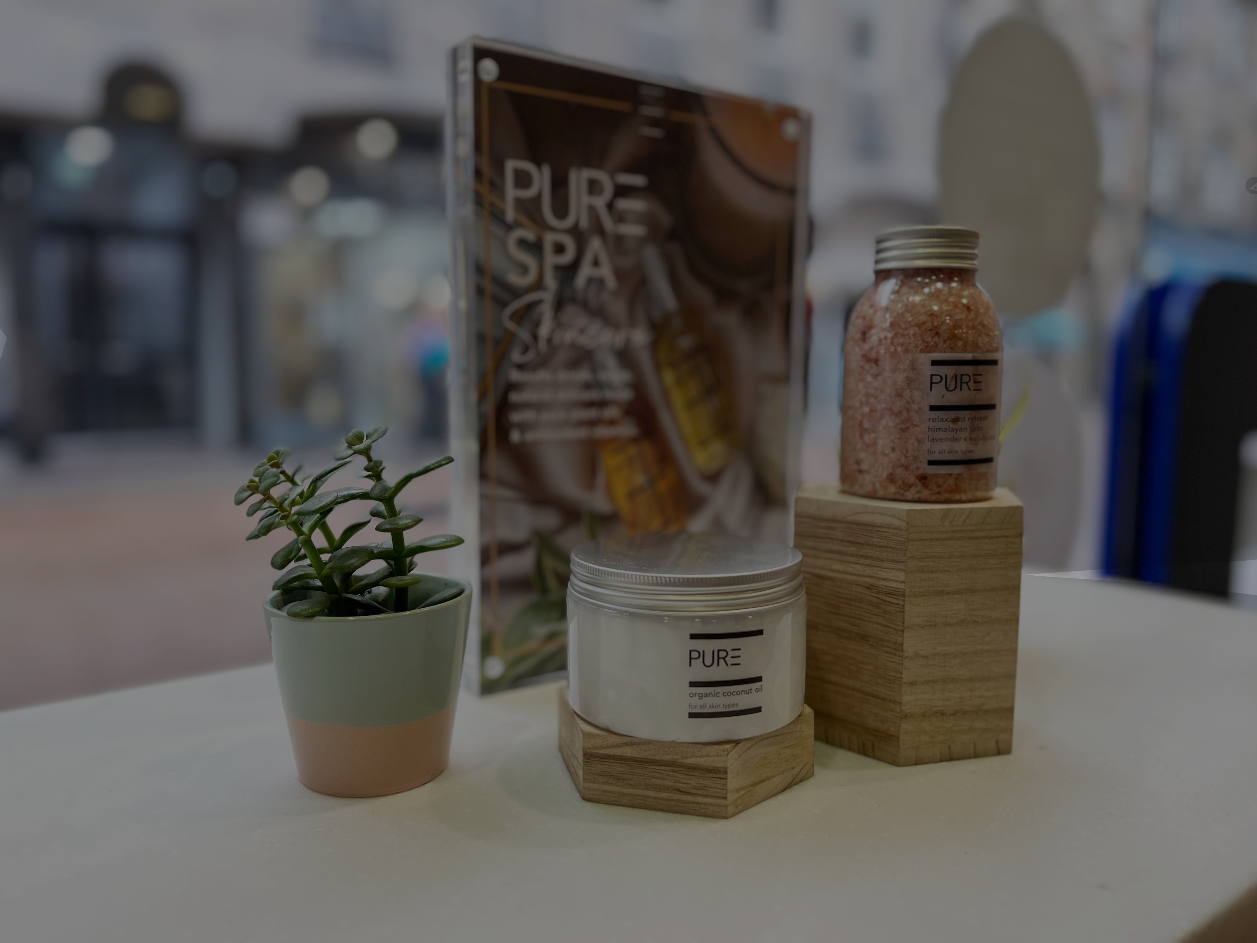 Decorative items on a table with 'PURE' branding